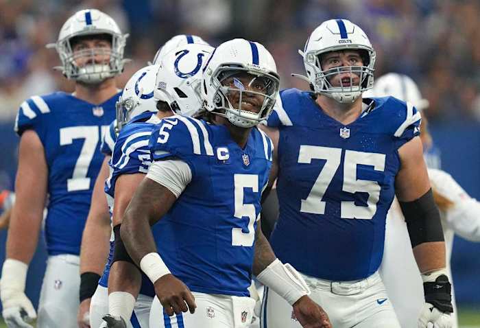 Indianapolis Colts quarterback Anthony Richardson (5) and fellow members of the Colts offensive line look to the score board after a play ended in the Los Angeles Rams' favor during the first half of the game Sunday, Oct. 1, 2023, at Lucas Oil Stadium in Indianapolis.  
